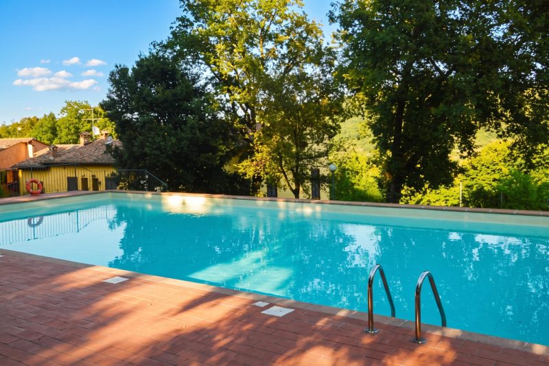 Tuscan Sun Duplex with Balcony and Shared Pool