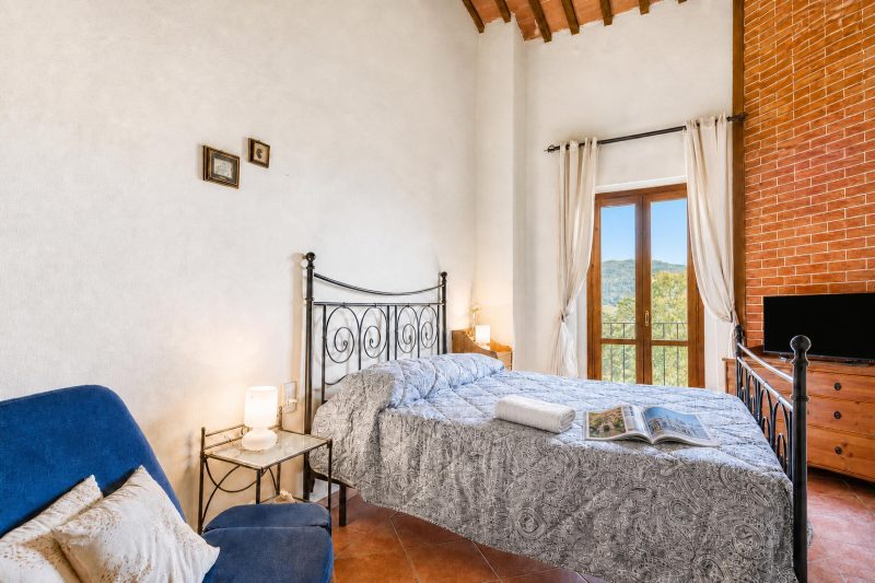 Tuscan Sun Duplex with Balcony and Shared Pool